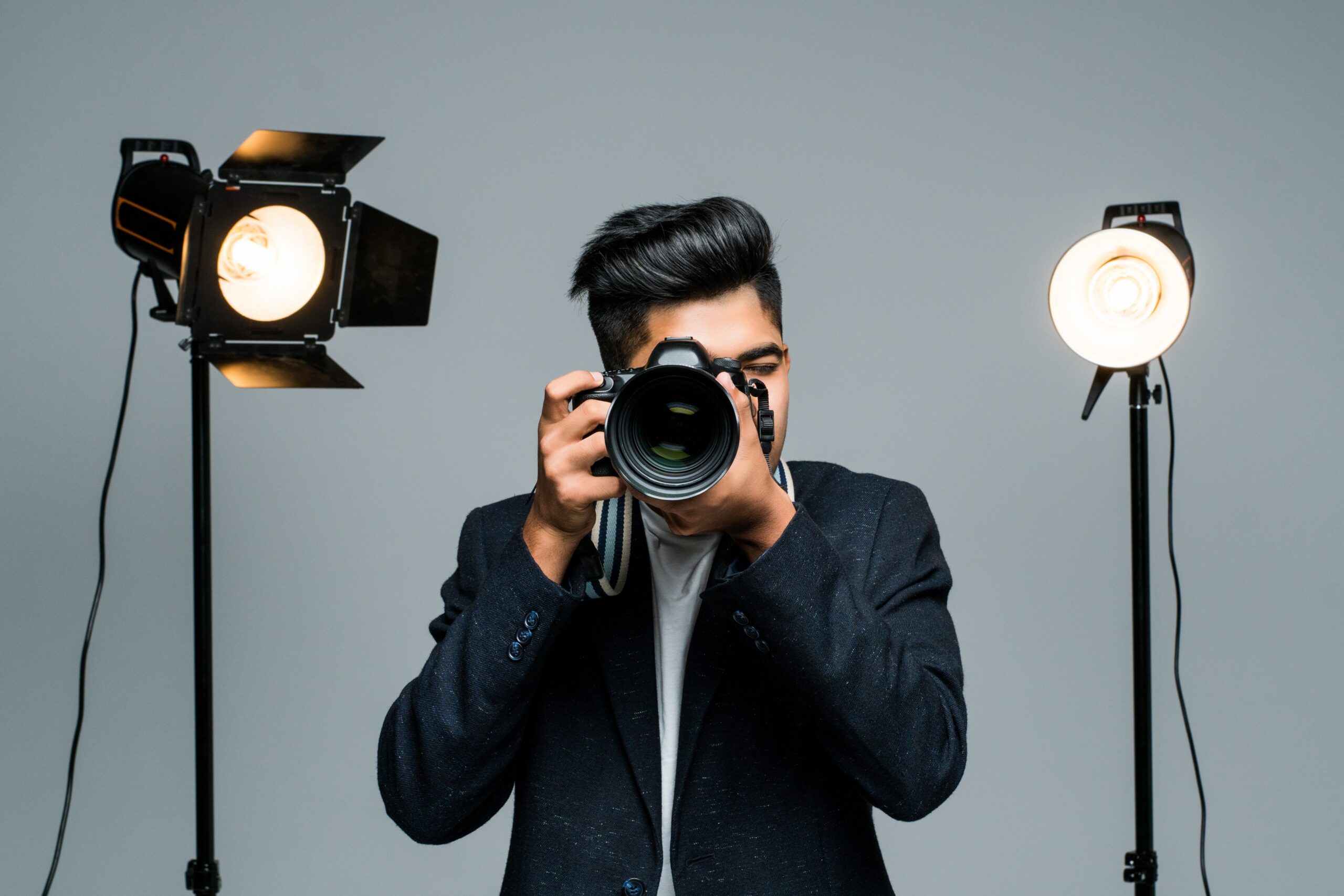 Professional indian photographer taking photos in studio with leight